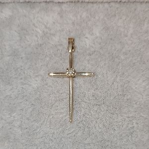 Diamond cross set in 14kt yellow gold pendant